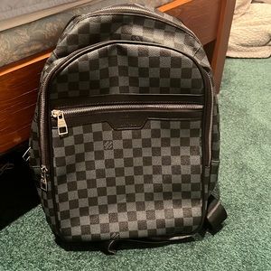Louis Vuitton black backpack. Replica